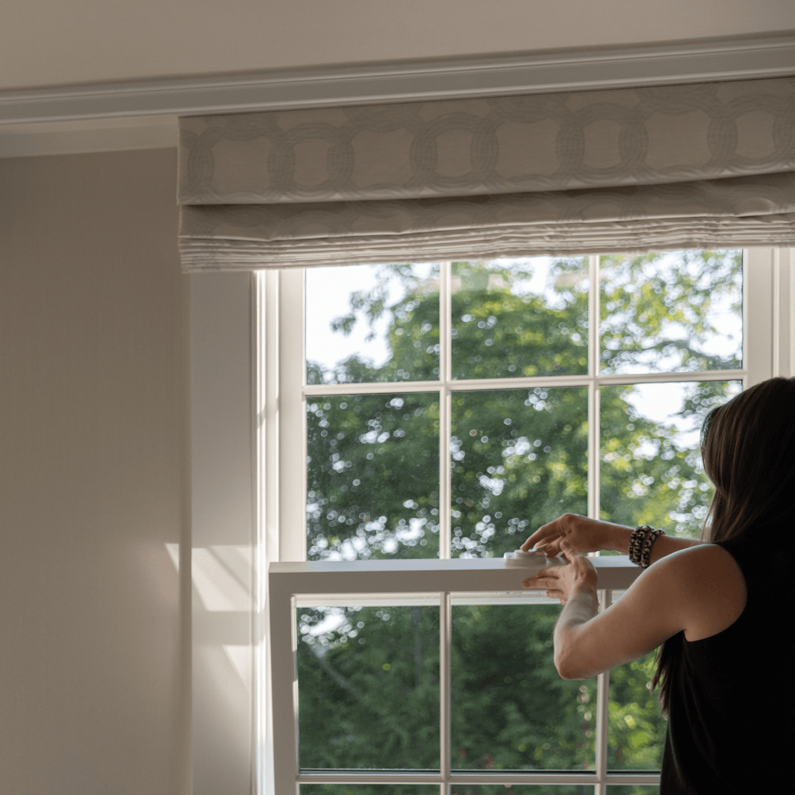 Woman in front of Marvin Ultimate Double Hung window